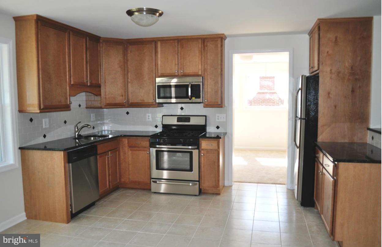 5309 Moultrie Road Springfield, VA 22151 - Photo 3 of 11 Kitchen looking through to family room
