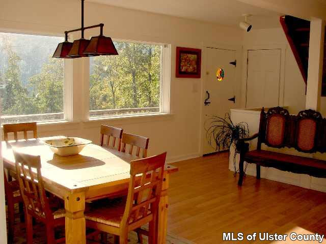 26 Carle Road Mount Tremper, NY 12457 - Photo 4 of 5 a view of a dining room with furniture window and outside view