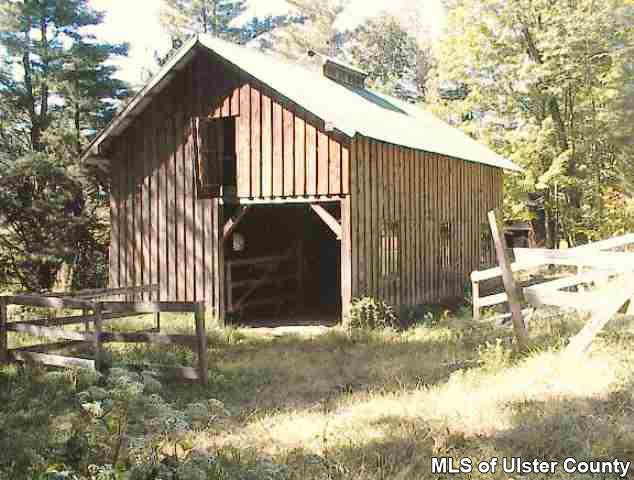 26 Carle Road Mount Tremper, NY 12457 - Photo 5 of 5 a backyard of a house with table and chairs
