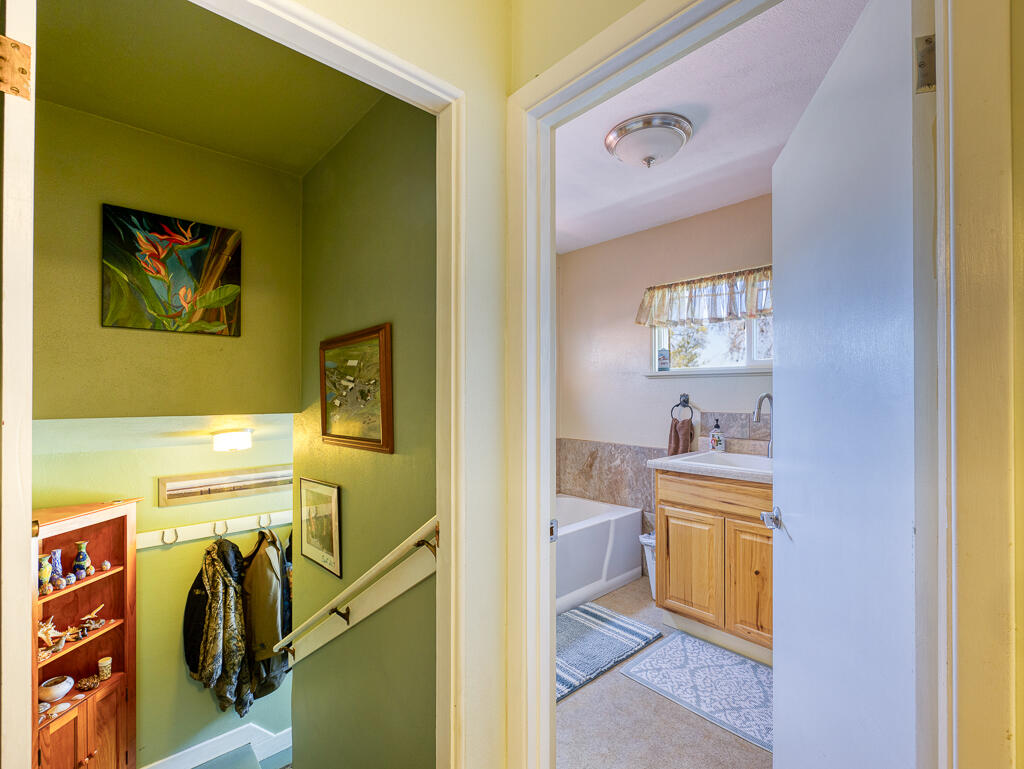 4650 Lower Klamath Lake Road Klamath Falls, OR 97603 - Photo 17 of 37 a view of a bathroom with sink cabinet and a living room