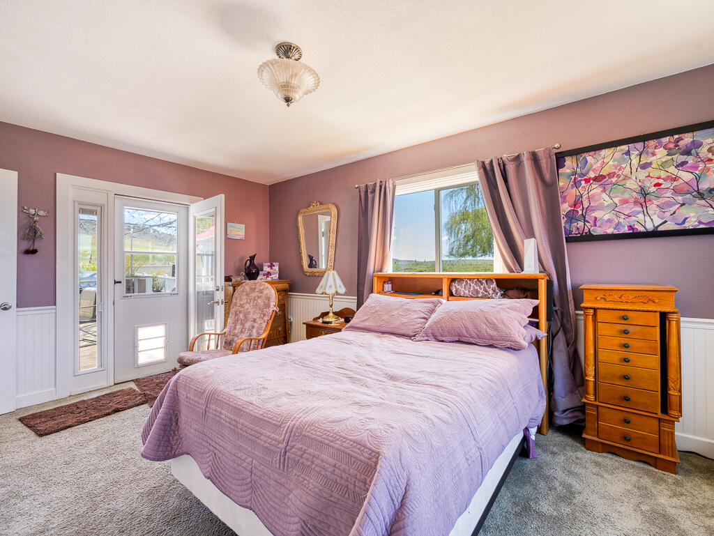 4650 Lower Klamath Lake Road Klamath Falls, OR 97603 - Photo 23 of 37 a bedroom with a bed and a large window