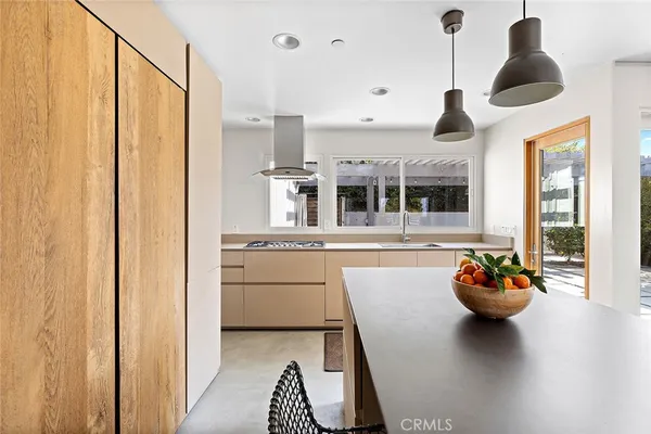 a kitchen with stainless steel appliances a refrigerator and a sink