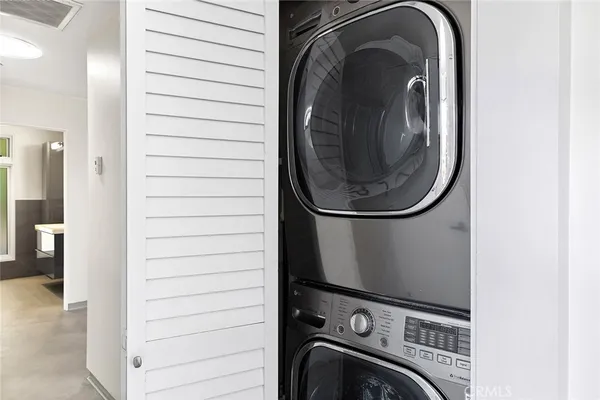 a close view of a utility room with dryer and washer