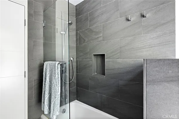 a bathroom with a shower and toilet