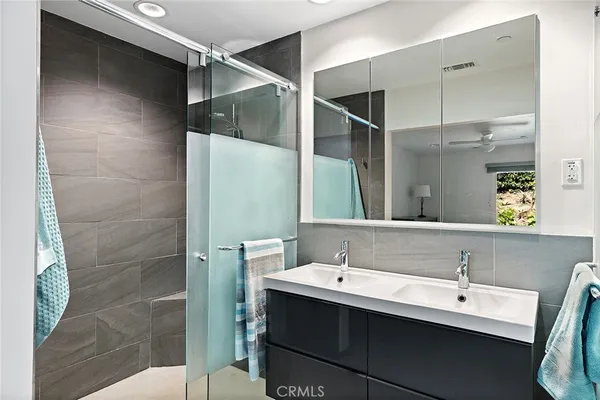 a bathroom with a sink and mirror