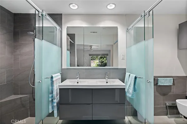 a bathroom with a sink and mirror