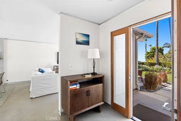 a bedroom with a bed and a mirror