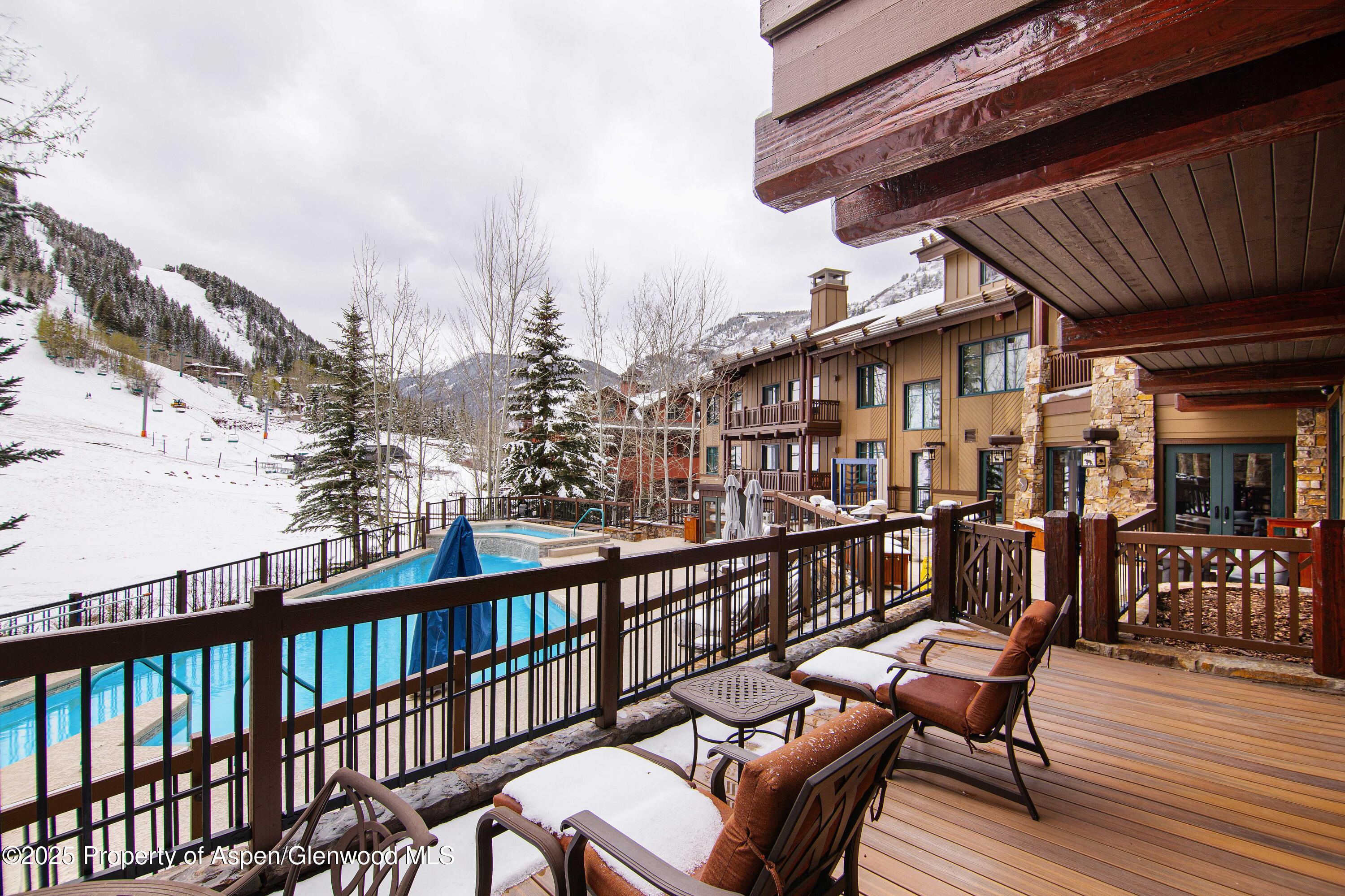 197 Prospector Road, Unit 2307SUMMER 12 Aspen, CO 81611 - Photo 4 of 18 a view of a chairs on the roof deck