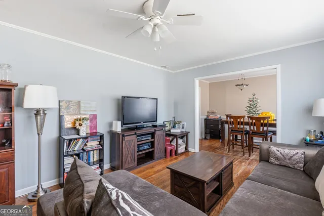 a living room with furniture and a flat screen tv
