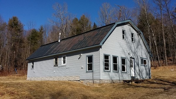 29 Dwight Cross Road Colrain, MA 01340 - Photo 1 of 10 a front view of a house with a yard