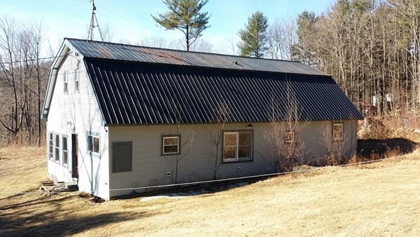29 Dwight Cross Road Colrain, MA 01340 - Photo 3 of 10 a front view of a house with a yard