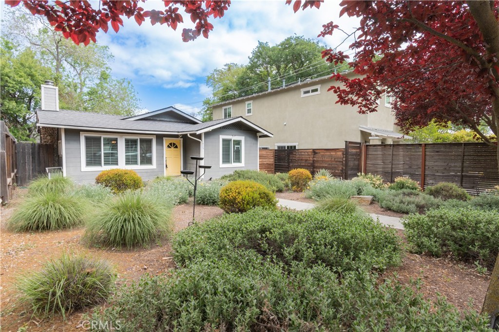 a view of a house with a yard and plants