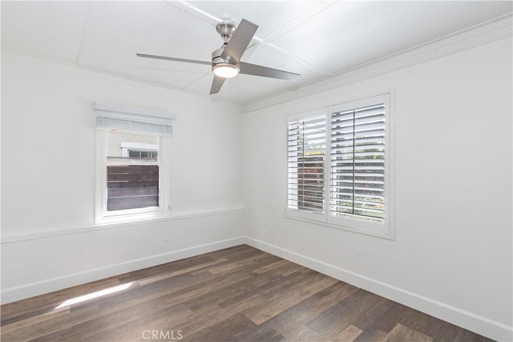 415 7th Street Paso Robles, CA 93446 - Photo 11 of 21 a view of an empty room with wooden floor and a window