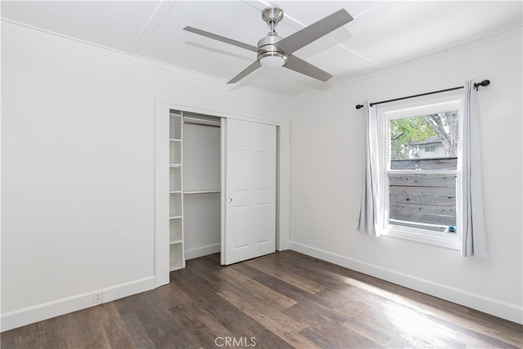 415 7th Street Paso Robles, CA 93446 - Photo 15 of 21 an empty room with wooden floor closet and windows