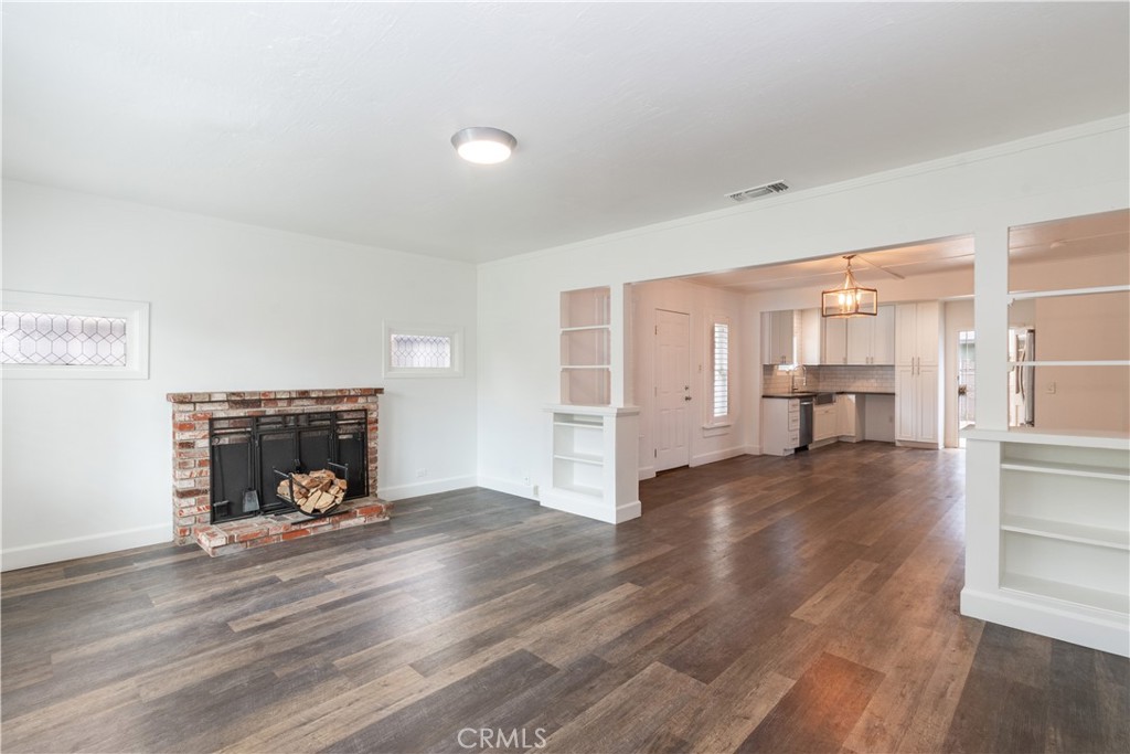 415 7th Street Paso Robles, CA 93446 - Photo 4 of 21 a view of a livingroom with wooden floor and a fireplace