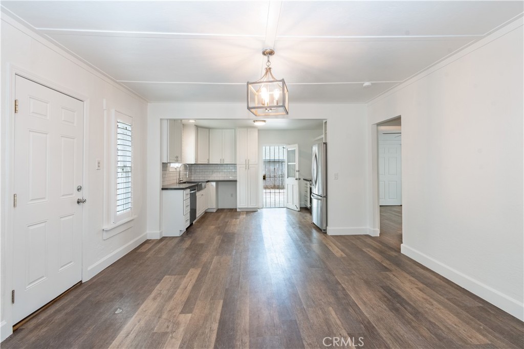 415 7th Street Paso Robles, CA 93446 - Photo 8 of 21 a view of a kitchen with wooden floor and a window