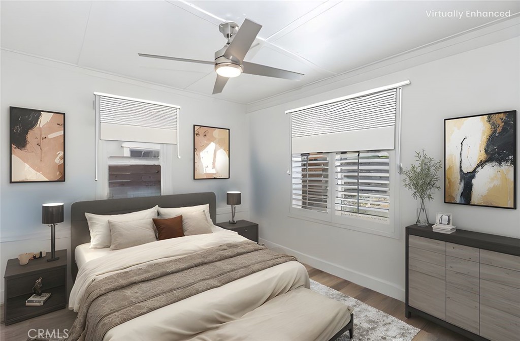 415 7th Street Paso Robles, CA 93446 - Photo 10 of 21 a bedroom with a large bed and a flat tv screen on dresser