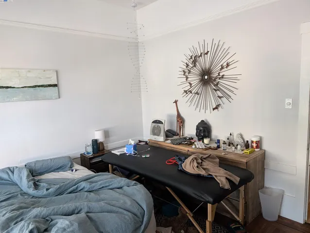 a bedroom with a bed and a table in it