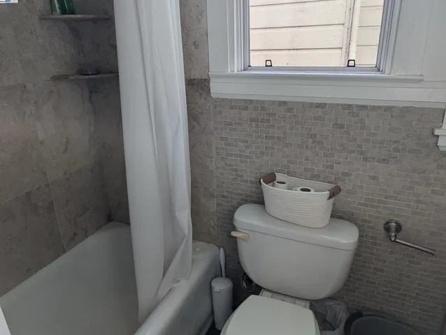 a bathroom with a toilet and sink