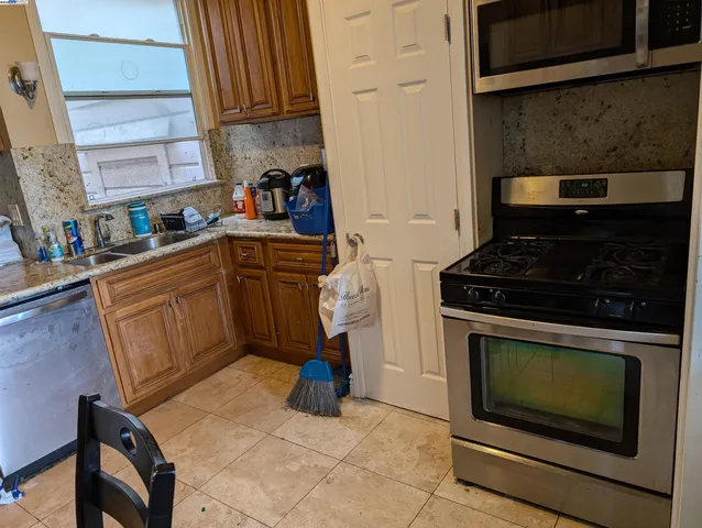 a kitchen with a stove and a cabinets