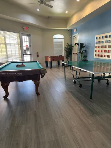 a living room with furniture a window and a table
