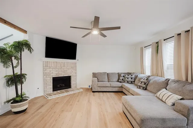 a living room with furniture fireplace and flat screen tv