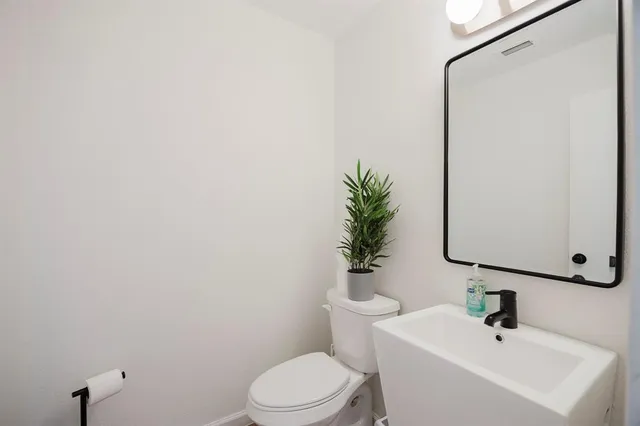 a kitchen with cabinets stainless steel appliances and a sink
