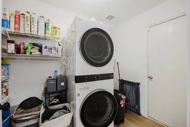 a bathroom with a sink a toilet a mirror and shower
