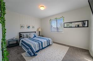 7935 Faithful Trail Dallas, TX 75237 - Photo 24 of 38 a bedroom with a bed and painting on the wall