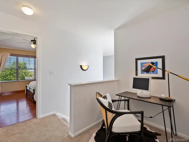 a view of a workspace with furniture