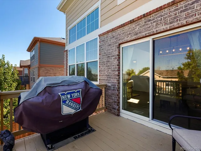 a view of a brick building with a bench in front of building