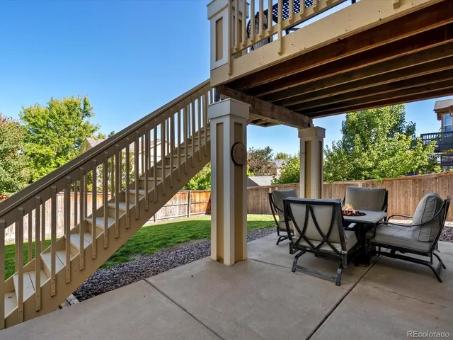 a view of a chair and table in the balcony