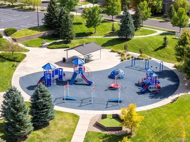 swimming pool view with a seating space and a garden
