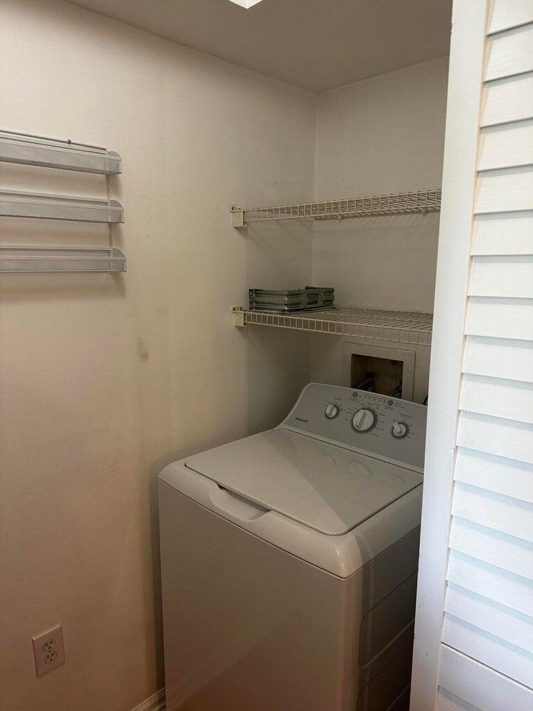 3615 Northwest Adriatic Lane, Unit 204 Jensen Beach, FL 34957 - Photo 24 of 40 a utility room with dryer and washer