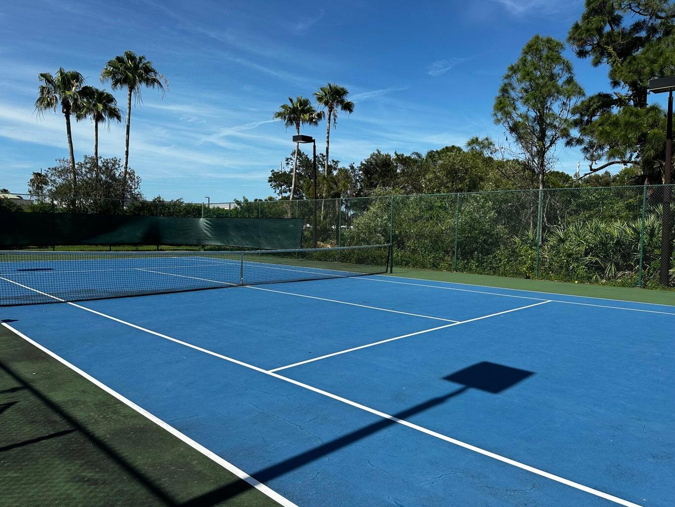 3615 Northwest Adriatic Lane, Unit 204 Jensen Beach, FL 34957 - Photo 30 of 40 a view of a tennis court