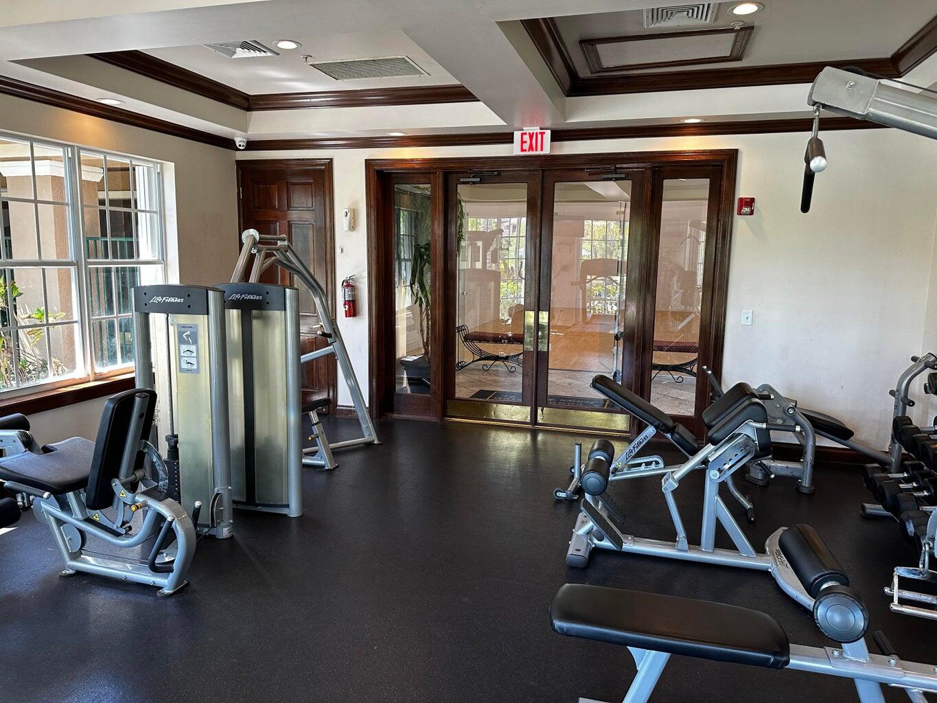 3615 Northwest Adriatic Lane, Unit 204 Jensen Beach, FL 34957 - Photo 34 of 40 a view of a room with gym equipment