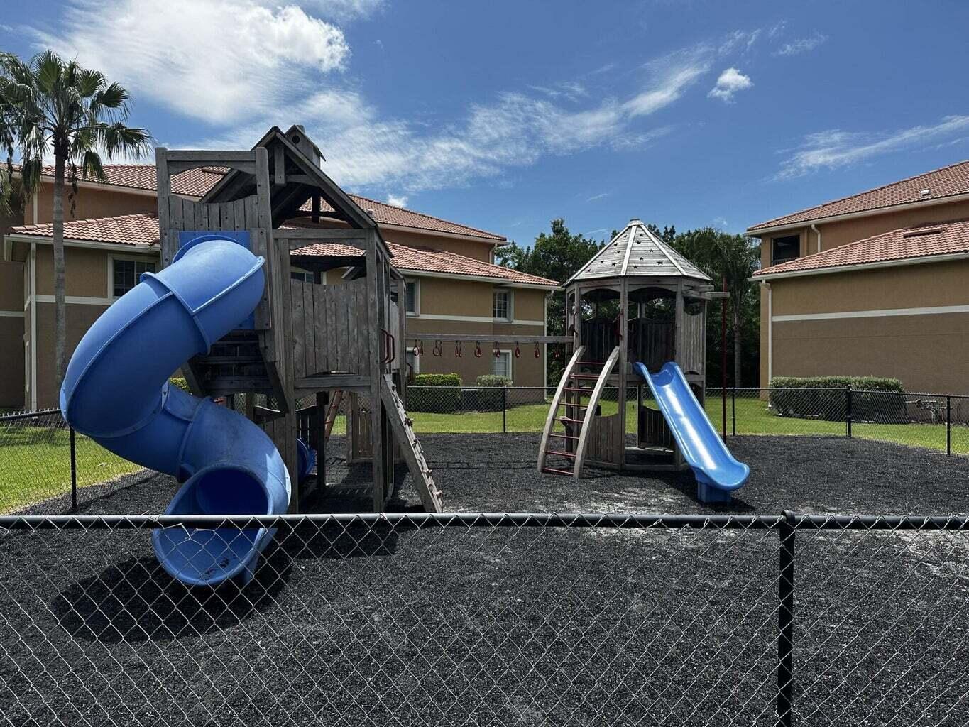 3615 Northwest Adriatic Lane, Unit 204 Jensen Beach, FL 34957 - Photo 35 of 40 a childrens park with lots of swings and slides