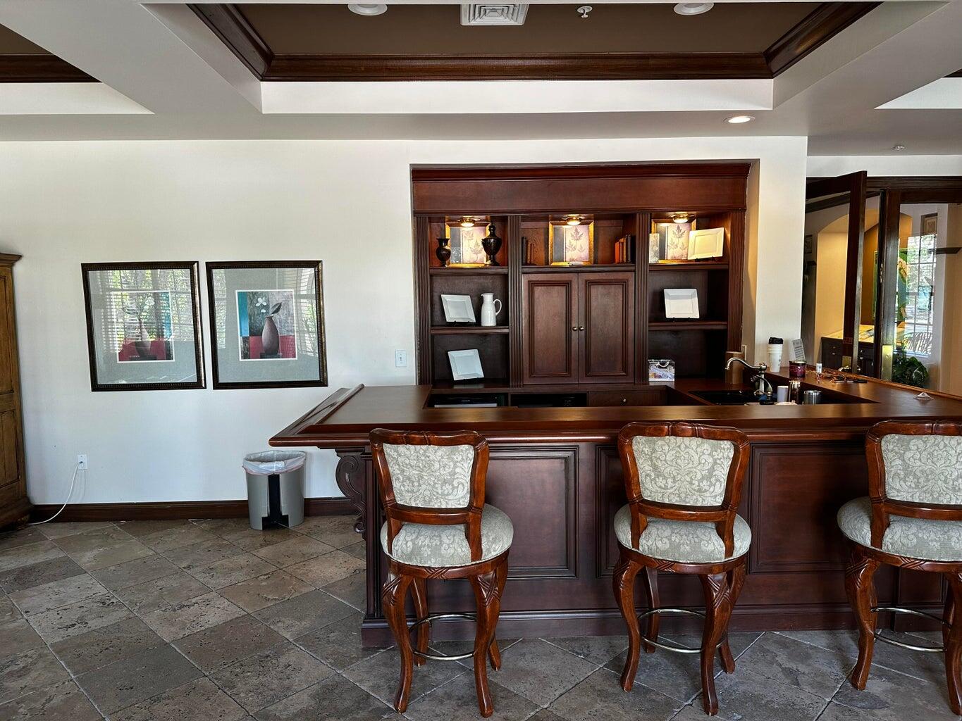 3615 Northwest Adriatic Lane, Unit 204 Jensen Beach, FL 34957 - Photo 36 of 40 a living room with furniture and a potted plant
