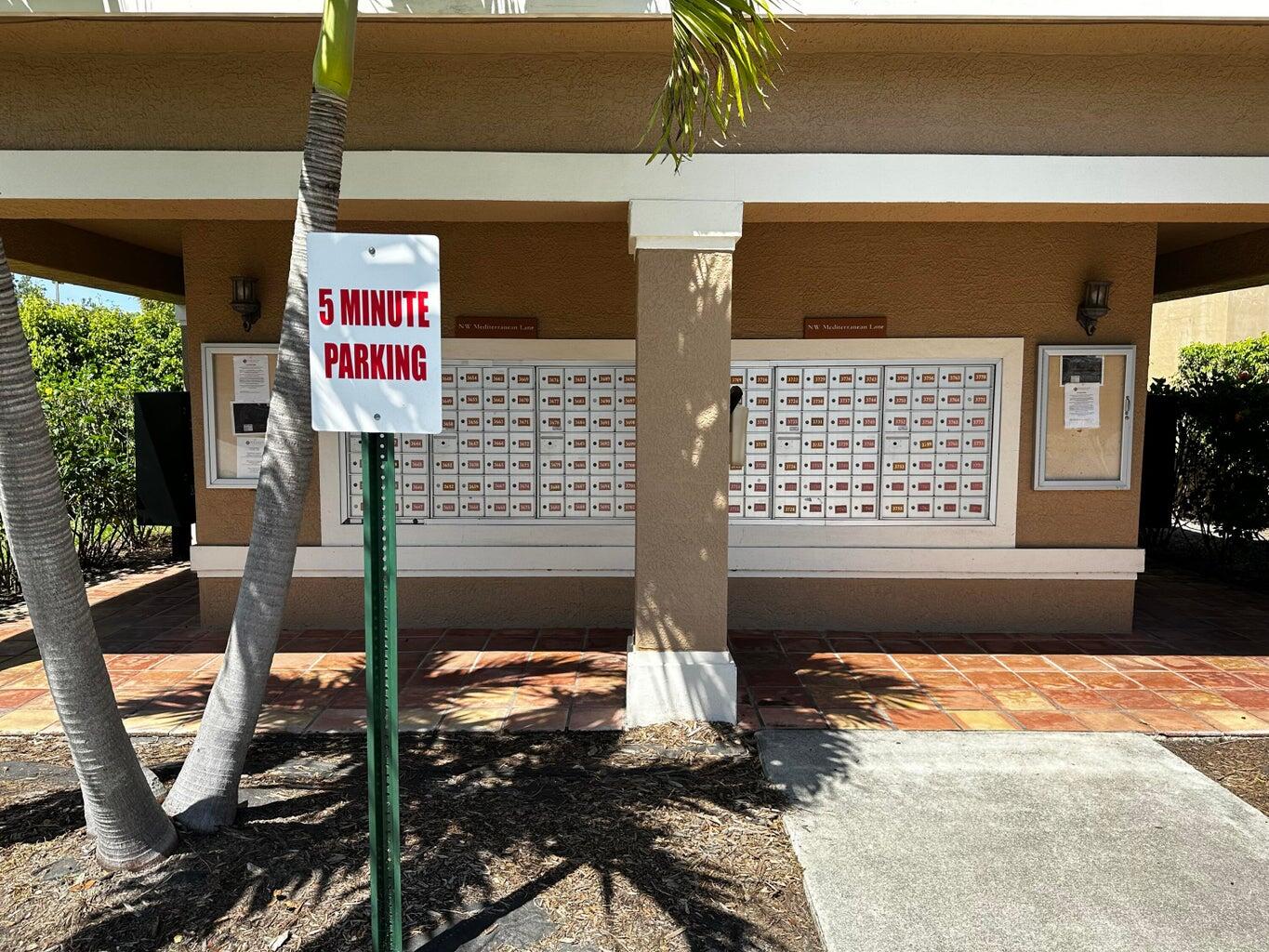 3615 Northwest Adriatic Lane, Unit 204 Jensen Beach, FL 34957 - Photo 39 of 40 a street sign on a street
