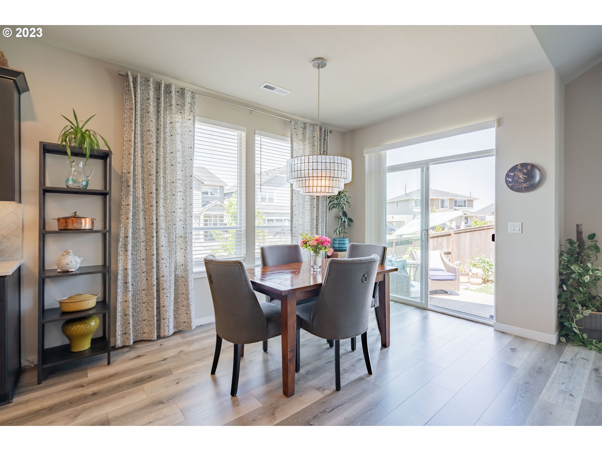 8518 North 1st Street Ridgefield, WA 98642 - Photo 11 of 41 a view of a dining room with furniture wooden floor and chandelier
