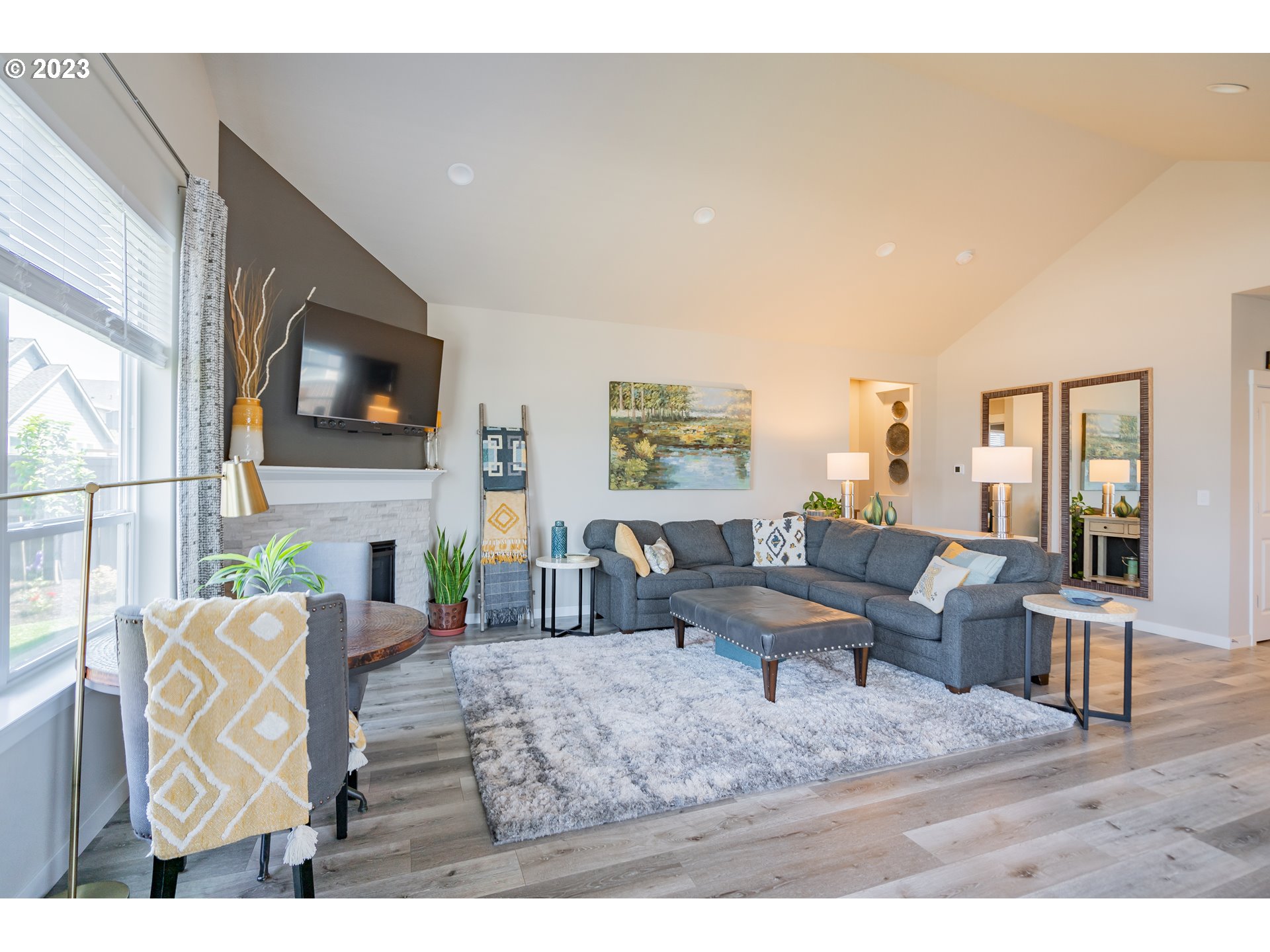 8518 North 1st Street Ridgefield, WA 98642 - Photo 12 of 41 a living room with furniture and a flat screen tv