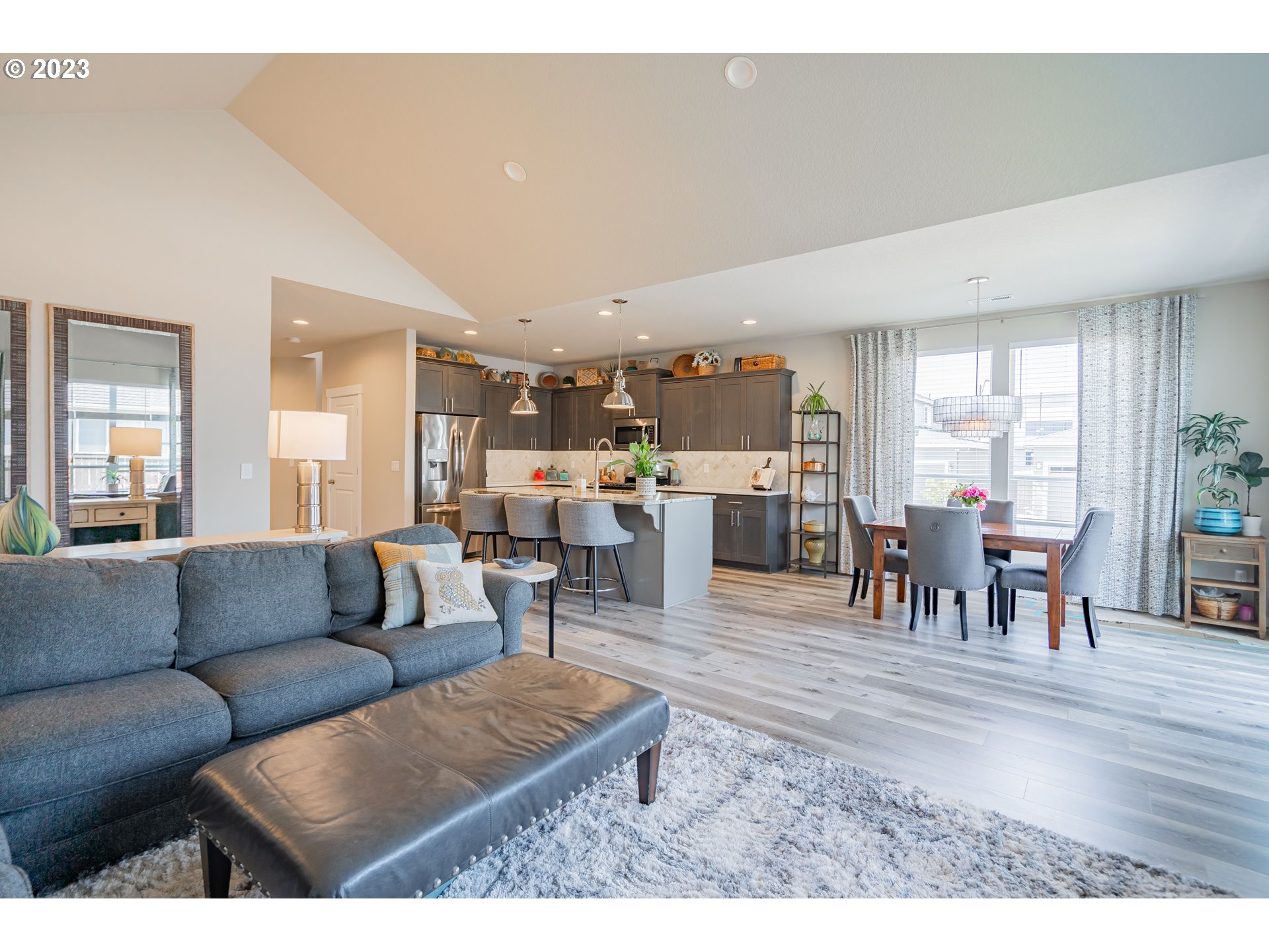 8518 North 1st Street Ridgefield, WA 98642 - Photo 13 of 41 a living room with furniture and a dining table