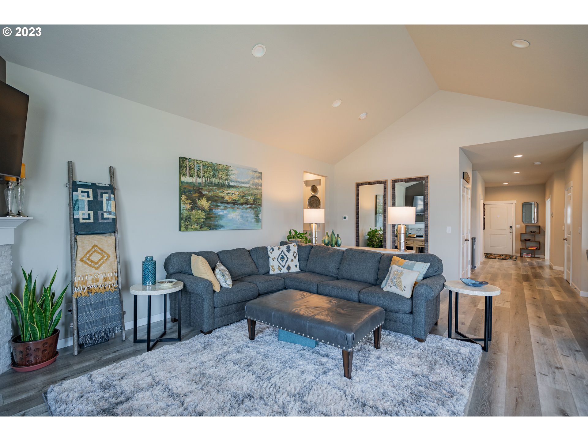 8518 North 1st Street Ridgefield, WA 98642 - Photo 14 of 41 a living room with furniture and a flat screen tv