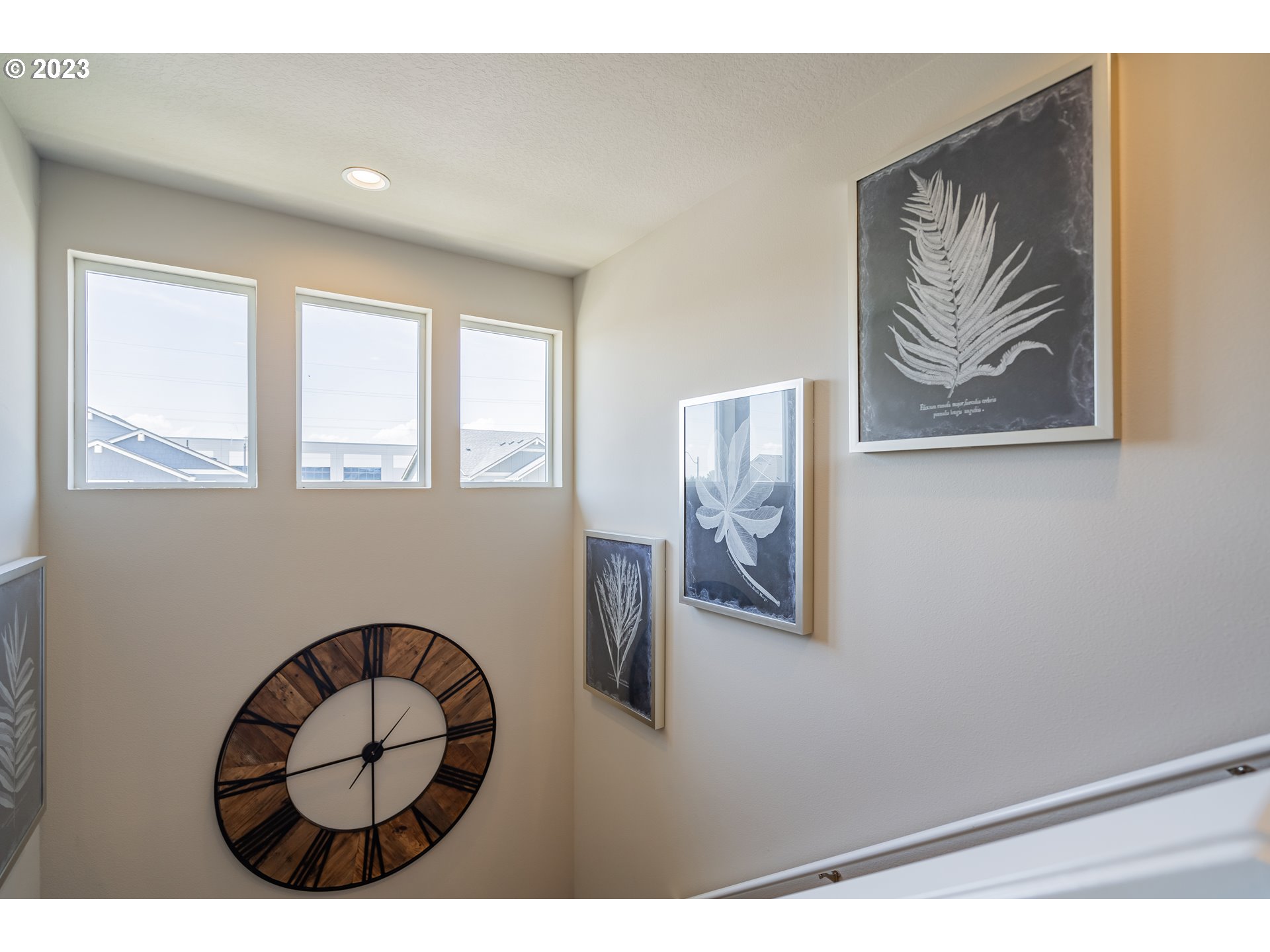 8518 North 1st Street Ridgefield, WA 98642 - Photo 24 of 41 a picture of a living room with windows and wooden floor