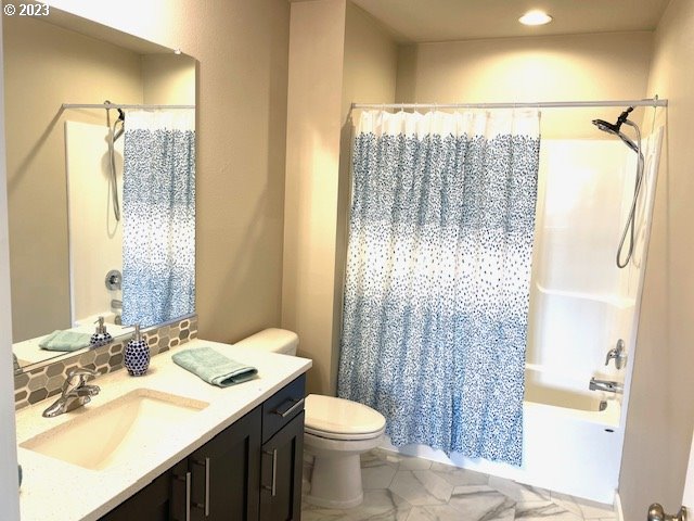 8518 North 1st Street Ridgefield, WA 98642 - Photo 30 of 41 a bathroom with a sink vanity mirror and toilet