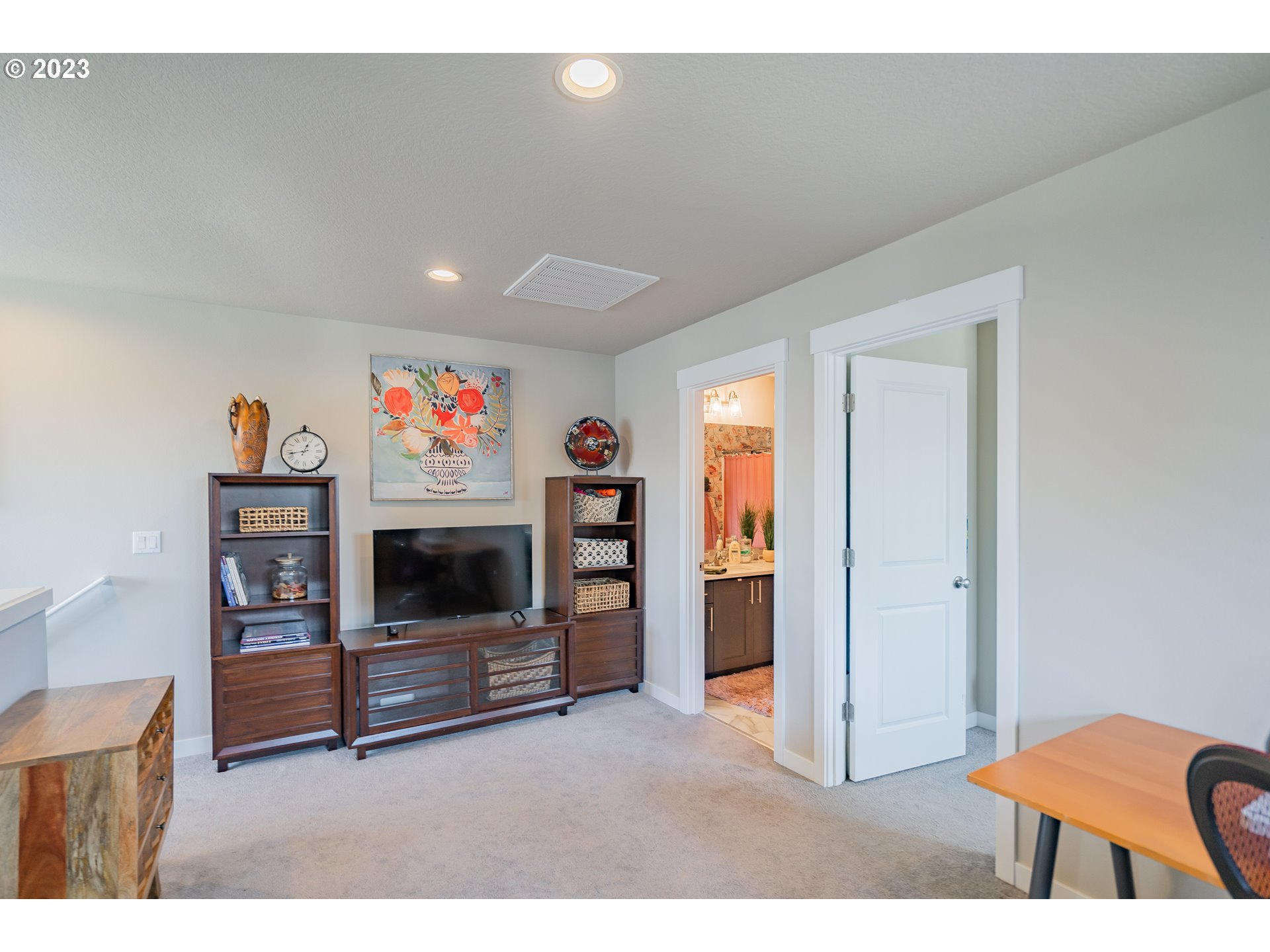 8518 North 1st Street Ridgefield, WA 98642 - Photo 31 of 41 a living room with furniture and a flat screen tv
