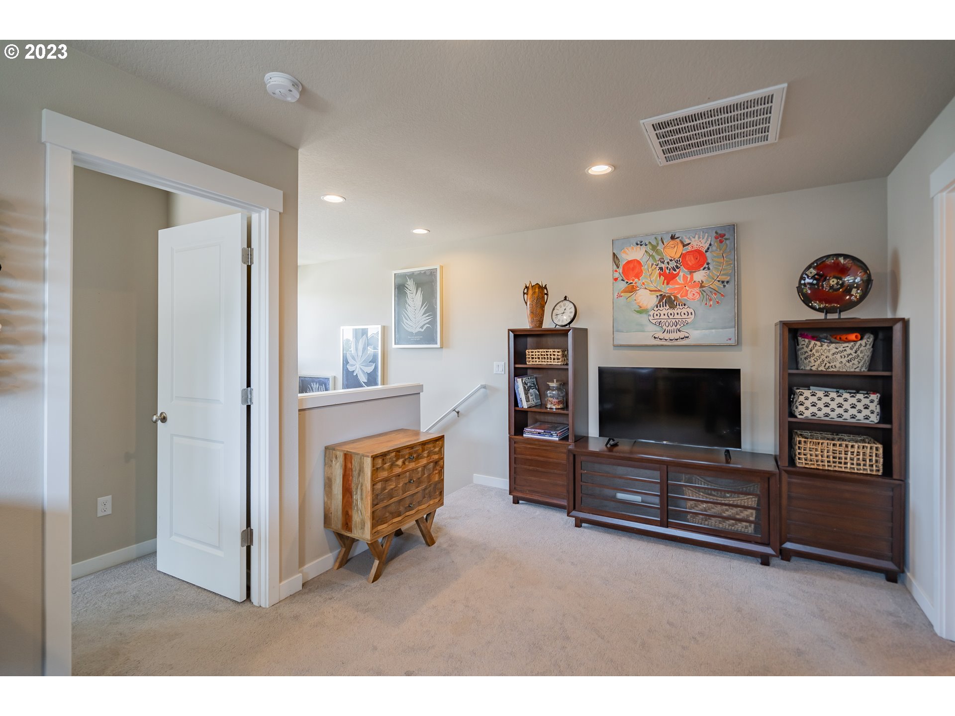 8518 North 1st Street Ridgefield, WA 98642 - Photo 32 of 41 a living room with furniture and a flat screen tv