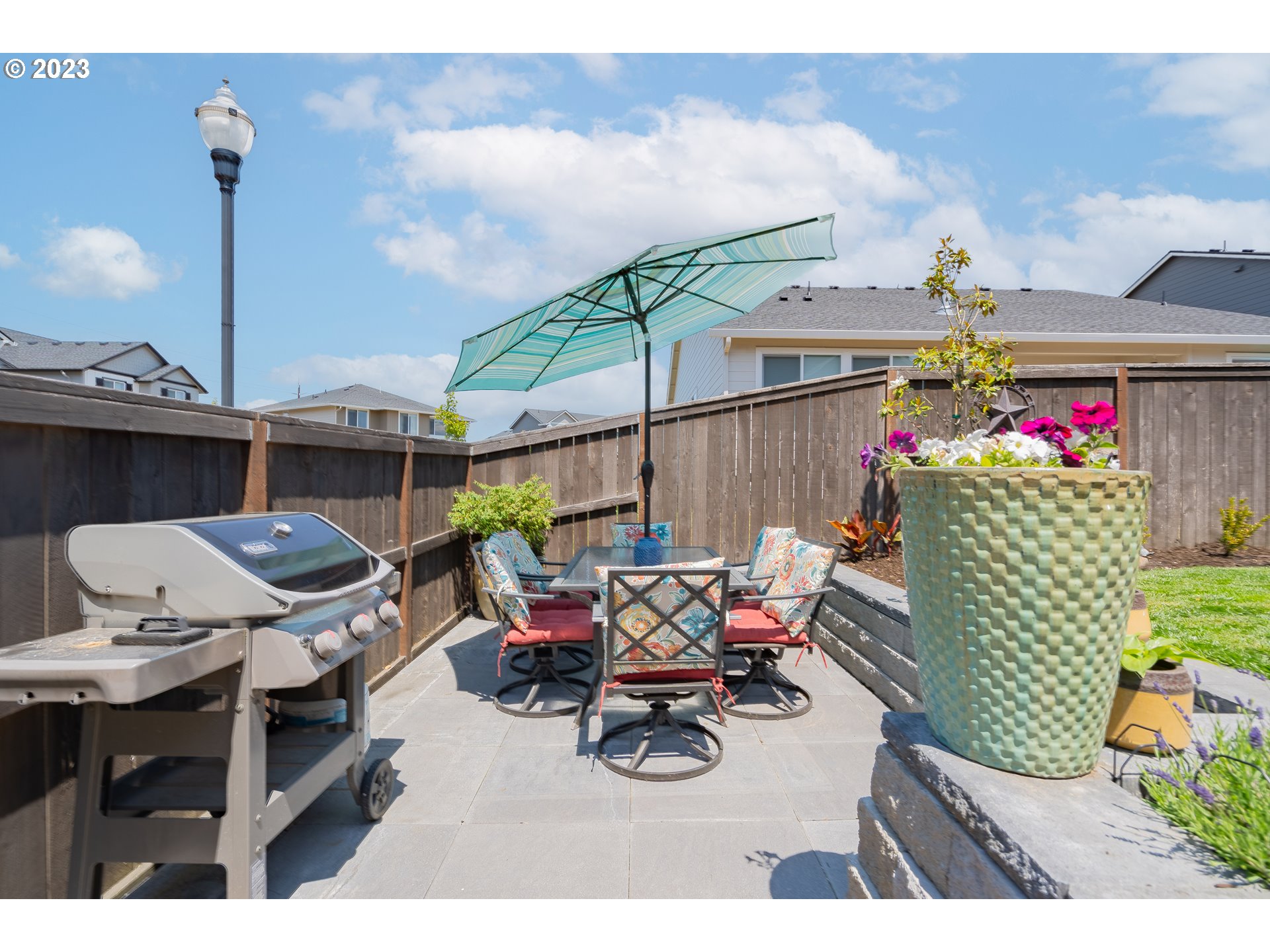 8518 North 1st Street Ridgefield, WA 98642 - Photo 38 of 41 a view of a roof deck with table and chairs