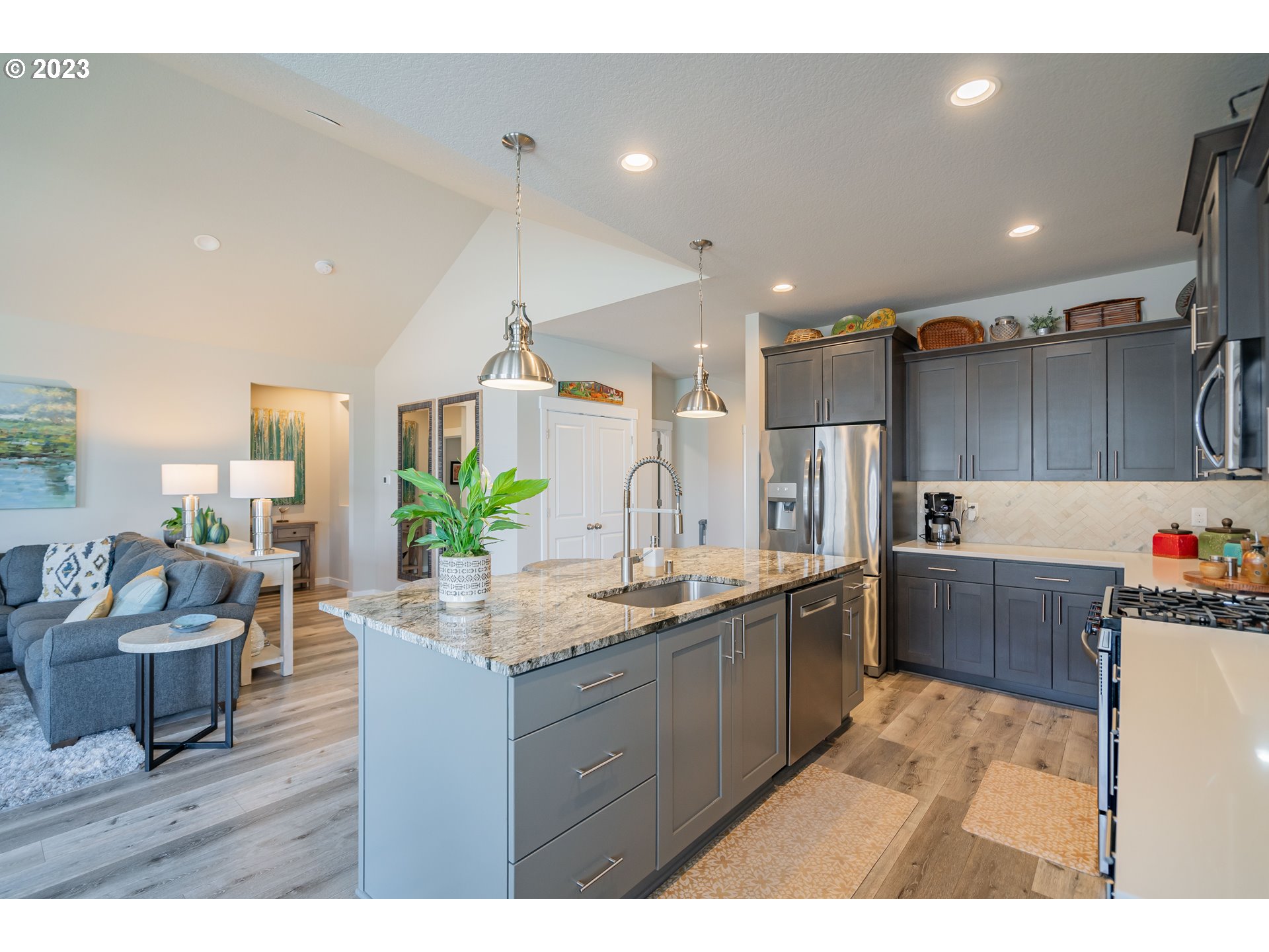 8518 North 1st Street Ridgefield, WA 98642 - Photo 6 of 41 a kitchen with granite countertop a sink and cabinets