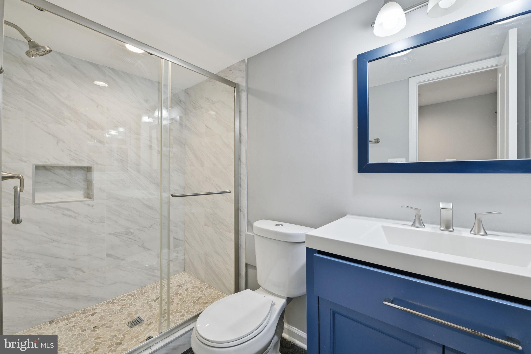 824 Allison Street Northwest Washington, DC 20011 - Photo 15 of 26 a bathroom with a sink a toilet and shower